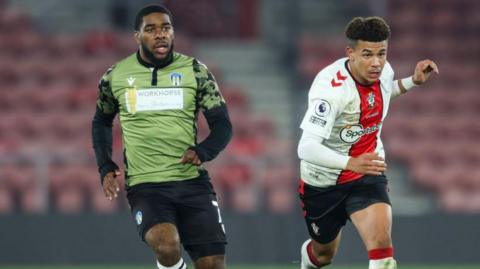 Jayden Fevrier of Colchester United and Josh Squires of Southampton B during the Premier League Cup match
