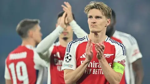 Dejection for Arsenal at the end of their Champions League game against Paris St-Germain