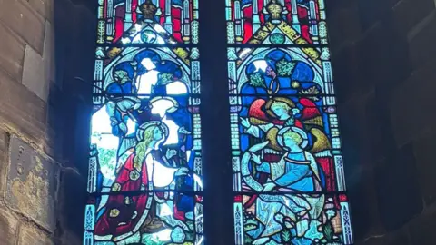 St Mary the Virgin Church Stained glass window showing damage