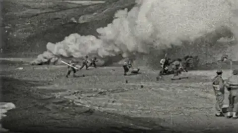 Archive shot of troops on the beach.