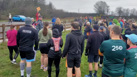 Amanda Cooper A crowd at park run getting ready to run at one of Amandas briefings