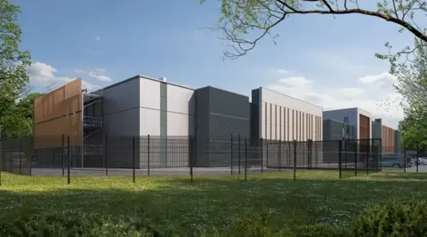 Ark Data Centres A building which looks quite high-tech surrounded by black fences and grass