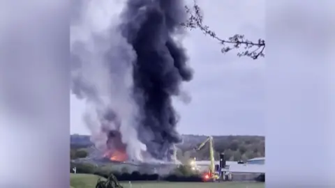 Smoke and flames from a fire.