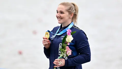 Charlotte Henshaw posing with her medal