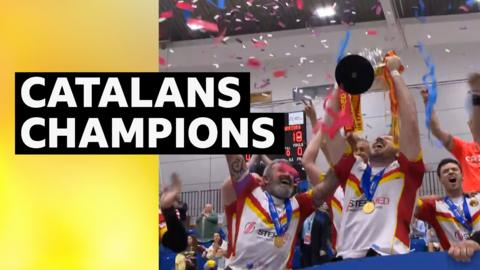 Catalans Dragons celebrating with trophy