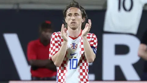 Luka Modric claps at the end of a match for Croatia 