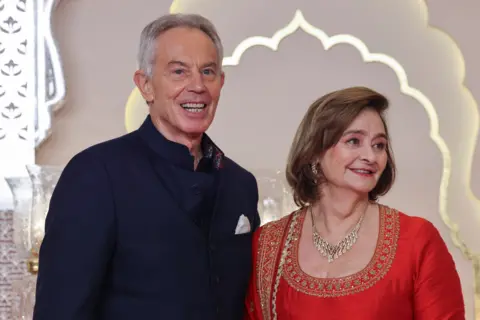 Reuters Tony Blair and his wife Cherie arriving at the wedding