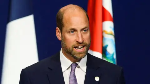 Prince William is speaking on stage.