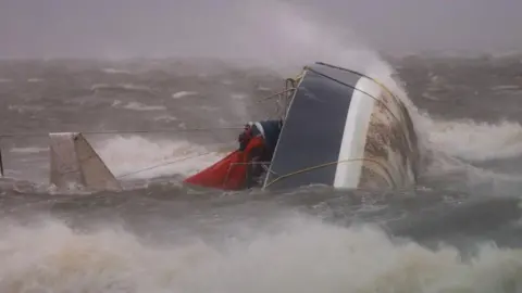 Joe Raedle/Getty Images A capsized boat washes ashore in Saint Petersburg, Florida
