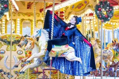 Lesley Martin/Reuters Scottish Ballet dancer Melissa Parsons poses on a carousel 
