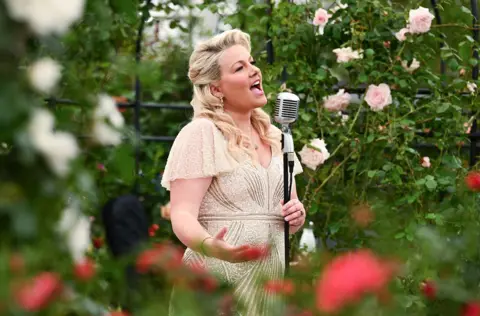 Jeff Spicer/Getty Images Natalie Rushdie performs at the RHS Chelsea Flower Show 2026 at The Royal Hospital Chelsea on May 18, 2026 in London, England.