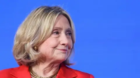 Hillary Clinton smiles while appearing at an event in India