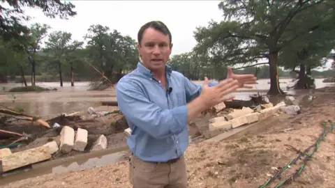 John Allen surrounded by mud 