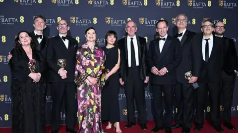 Getty Images A picture of the cast and crew (and Robert Harris) of Conclave, in front of the hoardings at the Royal Festival Hall in London on Sunday.