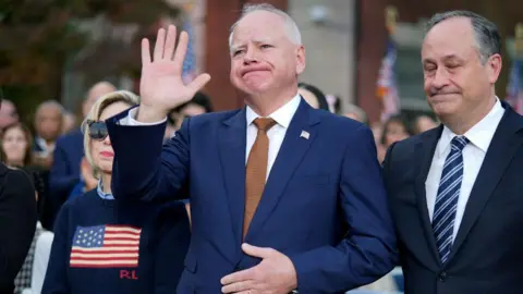 Getty Images Tim Walz, accompanied by his wife and Harris's husband, was in the crowd