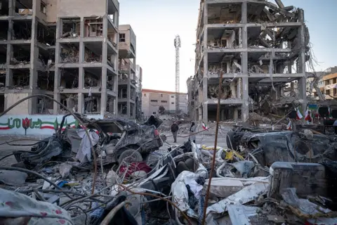 Getty Images People visit a residential area in Tehran, Iran, on April 9, 2026, that was affected during U.S.-Israeli military operations on March 9