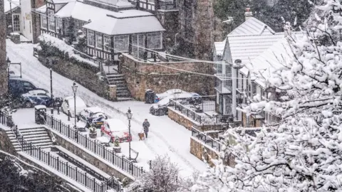 PA Media Snow coats a residential street in Knaresborough 