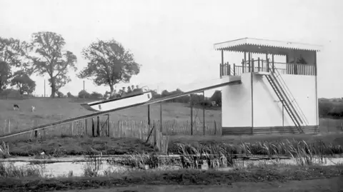 Wicksteed Park A black and white photo of the water chute. 