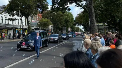 Crowds gathered to pay tribute to Elsie as the procession made its way down Lord Street in Southport