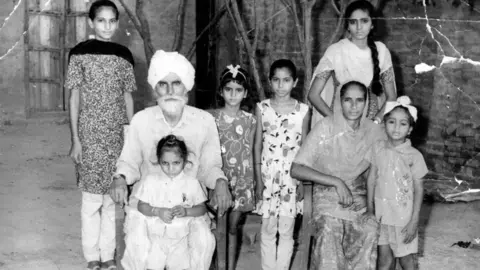 Stories that Made Us Archive A black and white photograph of a family in Punjab, India.