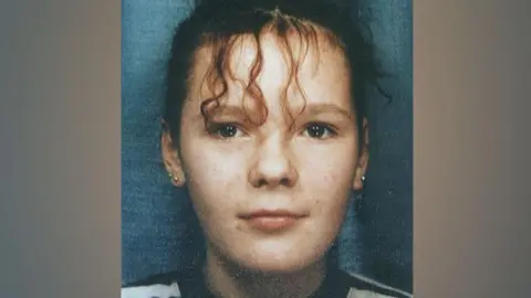 PA Media A close-up passport style photo of Lindsay Rimer with tied up curly hair, believed to have been taken when she was around 13 years old.