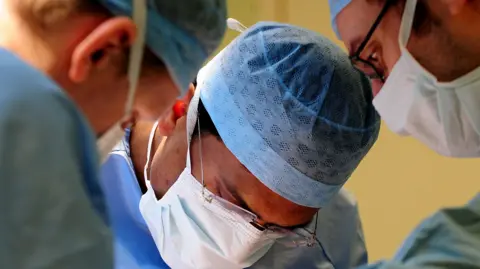 PA Surgeons operating in a hospital