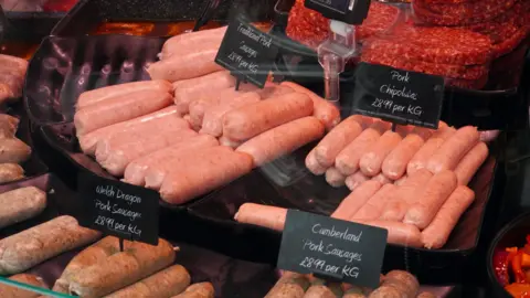 Getty Images Sausages in a butcher's shop