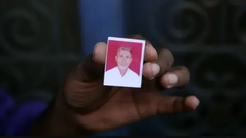 AFP A picture of Mohammad Akhlaq in which he is wearing a white shirt 