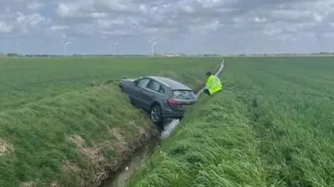 car crash into a ditch