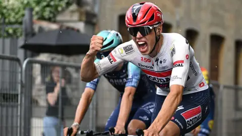 Paul Magnier celebrates winning stage 18 