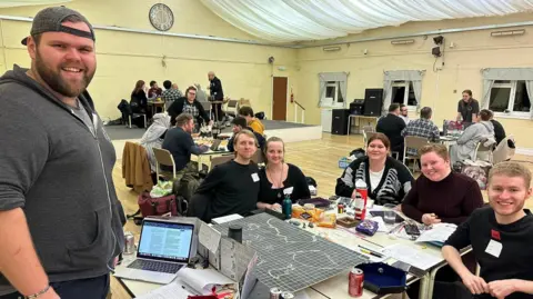 Charity Gaming Guild A group of Dungeons and Dragons enthusiasts playing at an event 