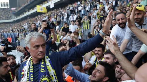 Jose Mourinho is greeted by Fenerbahce fans
