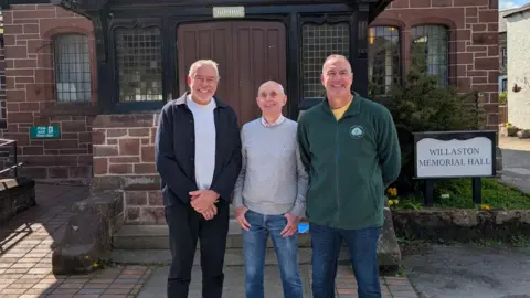 A view of Martin Townley, Paul Clegg and Tony Ashcroft standing in front of Willaston Memorial Hall