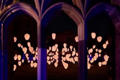 Matthew Andrews Dozens of illuminated lanterns in the courtyard at Durham Cathedral.