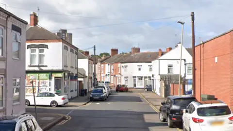 Google view of Maynard Road in Leicester where cars are parked on either side of the road
