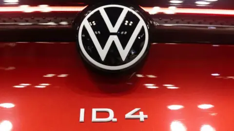 Getty Images The badge of a Volkswagen ID.4 electric sports utility vehicle (SUV) during the 2022 New York International Auto Show (NYIAS) in New York, U.S., on Thursday, April 14, 2022. 