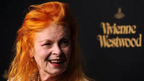 Getty Images Vivienne Westwood smiles off camera with her iconic orange hair