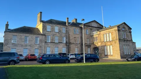 The former hospital is Georgian period building built of sandstone blocks. 