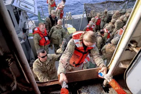 Ministry of Defence British army personnel wearing life jackets aboard RFA Cardigan Bay