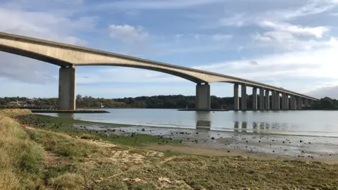 The Orwell Bridge over the River Orwell on a sunny day.