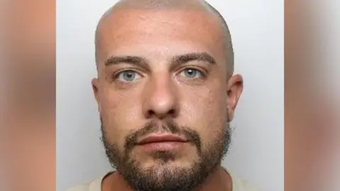 South Yorkshire Police A mug shot of Morgan Hardy