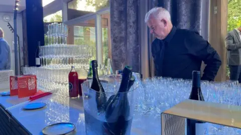 man preparing champagne