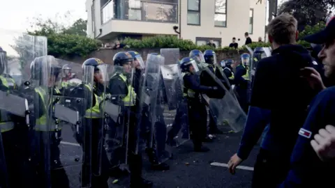 PA Media Police and protesters clashing in Southampton during a protest following the death of Henry Nowak.
