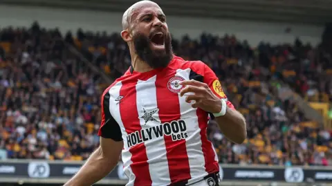 Bryan Mbeumo celebrating scoring a goal for Brentford last season.