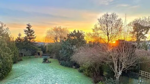 Buster's Back Yard Sunrise above a river. 