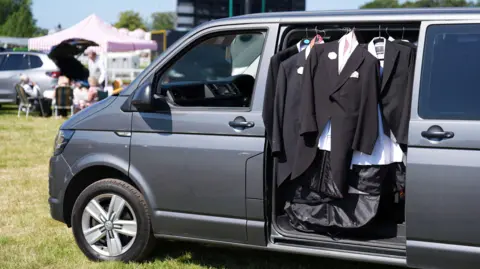 PA Media Suits hang up in a van in the car park before day four of Royal Ascot at Ascot Racecourse, Berkshire.
