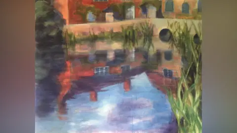 Wendy Brooke-Smith A scan of Wendy Brooke-Smith's piece of art that shows the millpond at Flatford Mill. It focuses on a pond where a building it reflected. Some green weeds have been painted around the pond.