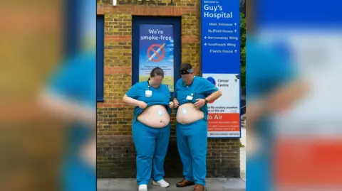 A screen grab of a promotional video showing two doctors in scrubs, outside Guy's hospital placing weight loss patches on their stomachs 