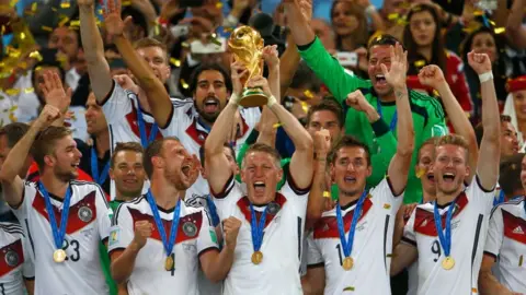 Getty Images Germany players lift the World Cup after winning the tournament in 2014