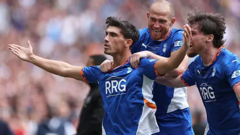 Kian Harratt of Oldham Athletic celebrates scoring his team's third goal with team-mates during the National League promotion final between Oldham Athletic and Southend United at Wembley